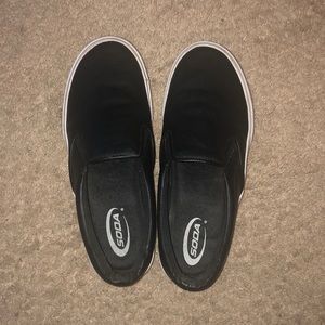 Black slip ons, leather material.